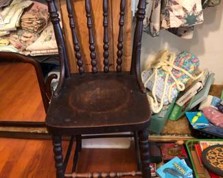 Antique child size high chair with cane seat