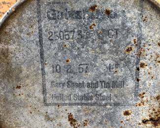 Bottom of tin floor ashtray