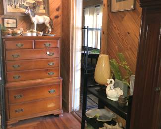 Old heavy dresser.  Large horse figure.  Vases including Roseville.