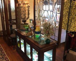 SOLDGlass panels and SOLDLighted display cabinet.  Lots of paperweights.  Hollywood Regency lamp.  