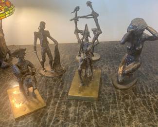 Grouping of five Prince Monyo bronze sculptures 