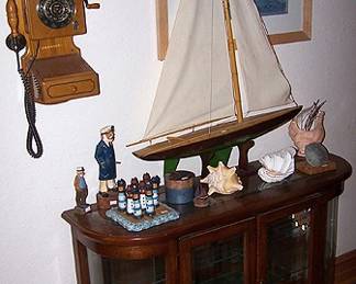 Small lighted display case, Crosley wall phone, sailboat
