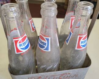 Pepsi bottles in metal crate