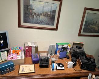Desktop items, old Kodak and Bell & Howell slide carousels, projector