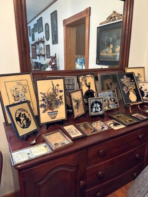 There are several silhouettes, lots of sizes and the condition is very good.  They're so pretty.  The buffet matches the dining table and another piece, all of them lovely.