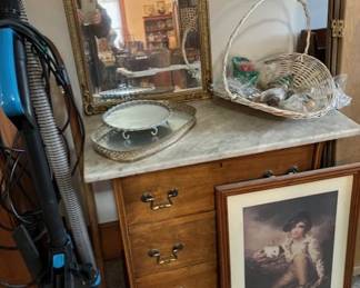 Very nice marble-topped piece.  And I love this picture.