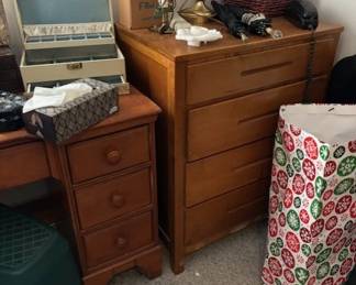 There are 3 smaller chests and a desk in this room.