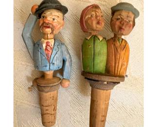 Two different vintage Italian carved wood animated (moving) bottle stoppers. The couple kisses when activated, the solo man tips his hat.