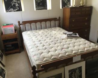 Nightstand, full size bed, Maple dresser w/8 drawers. Black & white photos.