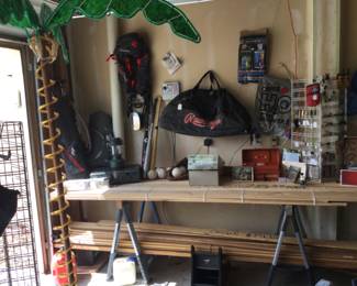 Golf clubs, tent, camping, bat bag, bats, softballs, solar shower & enclosure, new chest waders. Little bit of crown molding, base, 3 1/2” solid flooring. And a lighted palm tree.