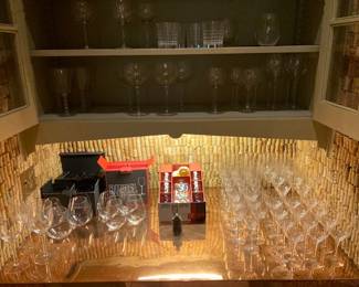 lots of wine glasses, all on the bottom right are Orrefors