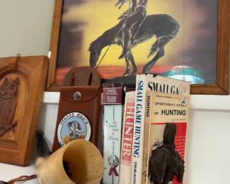 Metal bronco bookends, hunting books , horn, Howard Hills archery  leather pouch 