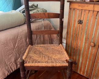 Ladder back chair with woven seat 