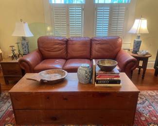 Leather sleeper sofa with matching loveseat , very long trunk