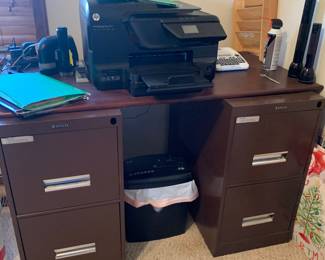 2 file cabinets with top to make work space.