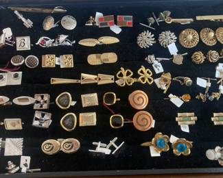 Collection of cuff links and tie tacks