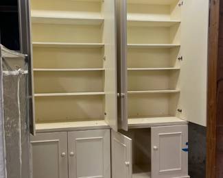 Interior view of the custom cabinet.  Lower cupboard each as one adjustable shelf.