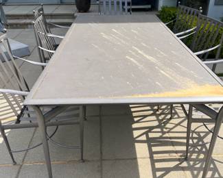 $4000.  Brown Jordan "Positano" dining table with 8 chairs.  Metal.  Cushions shown in following photo.  100"l x 45.5"w x 29"h.  Originally $7675.  Photo shows pollen which wipes off - it just keeps coming back every day.....  Available during  online beginning sale beginning Wednesday, May 8th at 8am and ending Thursday May 9th at 4pm.   Click on message seller to let us know you want to purchase it and we will reply with next steps.