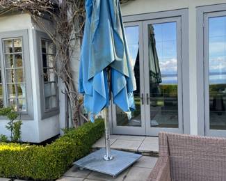 $500. Custom Tucci umbrella from Design Within Reach.   . Base is 36 inches square.  Umbrella is 10 x 14 rectangle.  Originally $7000.  as found.  Available during  online beginning sale beginning Wednesday, May 8th at 8am and ending Thursday May 9th at 4pm.   Click on message seller to let us know you want to purchase it and we will reply with next steps.