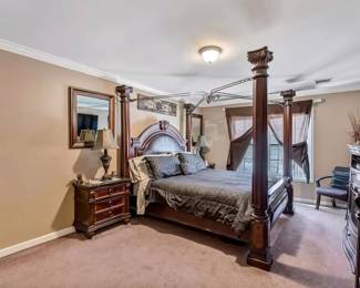 Elevate your bedroom with this exquisite four-poster king-size bed set, a true mark of craftsmanship and luxury. Constructed with rich, dark wood and featuring intricate detailing, this bed is the centerpiece of a master suite that speaks volumes of elegance. The set includes two matching nightstands and a spacious dresser, a tall hutch/ 2nd dresser and a fireplace all in excellent condition, promising both functionality and grandeur. Transform your sleeping quarters into a regal escape where comfort meets sophistication. Priced to find a new home where it will be cherished and admired. BEST OFFER