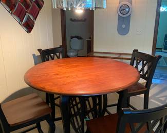 Ashely Furniture, Cherry Wood/Black Table with Underneath Wine Rack/Drawer. 4 Cherry Wood Black Side Chairs