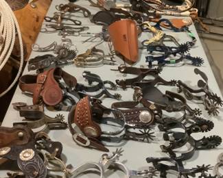Large collection of spurs and stirrups plus tapaderos         ( stirrup covers).  Styles of spurs include E. Garcia, Crockett, Colorado Saddlerey, Kelly, and Aime Imports.