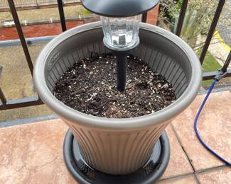 Grey Plastic Planter w/Solar Light,   2 available,  was $14 each, NOW $10 each