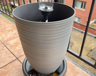 Tall planter on planter dolly w/ solar light,  2 available, was $24 each, NOW $16 each