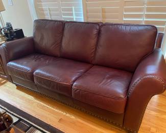 Burgundy leather sofa with nail head trim,  37"H x 91"W x 39"D,  was $699, NOW $425