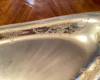 Additional view of fine detailing on oval silver serving platter ~