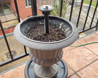 Grey Urn  Planter on planter dolly w/Solar Light,  2 available, was $26 each, NOW $18 each