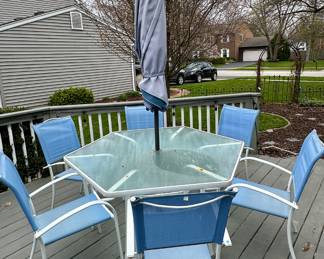 Glass table with 6 Chairs and Umbrella