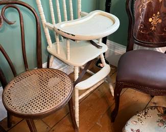 Wooden high chairs, cane chairs, dining chairs. 
