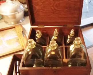 6 bottle Tantalus. Believed to be free-blown Italian glass.