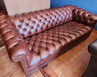 Brown leather chesterfield sofa
