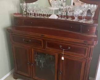 Beautiful Buffet / China Cabinet.  Beveled mirror.  3 drawers storage below mirror, fold out extension for serving w/ 2 support arms, 2 drawers (1 w/ flatware dividers), 3 lower storage areas (center with glass shelves).  Magnificient piece.  Well cared for.  Unique. 