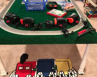 Choo Choo! Rolling train table with Lionel Fastrack layout! Transformers Too! Cute R/R rug below!