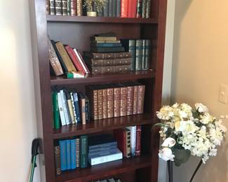 Bookcase filled with old and new material! Iron floor stand with faux flower arrangement! There are actually 2 of these!