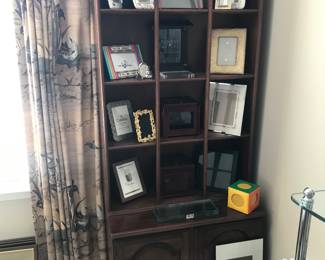 Picture frames of all sizes! Displayed in a nice solid wood curio!