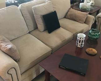 This comfy and beautiful couch has a matching chair! The coffee table has 2 matching end table with glass inserts!!