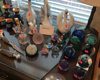 Beautiful collection of paperweights! Lladro swans too!