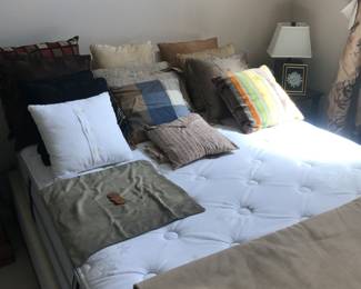 Loaded with nice decorative pillows!