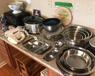 Stainless cookware in main floor kitchen! Small appliances such as toaster oven ,crockpot and hand mixers too!