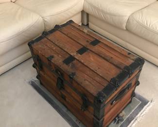 Steamer trunk on top of a nice rug!