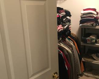 Walk in closet filled with Men's and Ladies clothing and shoes!