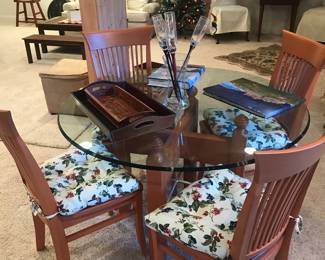 Glass topped table with 4 chairs! Table travel books and flutes! 