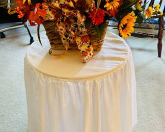 Round table with glass top.  Fall arrangement 