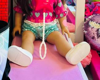 American Girl doll with lots of extra clothes 