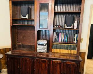 This very unique and nice entertainment center is handmade.  The top portion came out of the Hawkinsville Fruit and Candy Co. It was the grocery store  owned by Mr. Caberos father and  Mr. Cabero worked there for years. The bottom portion was made from an old fence that came out of Hawkinsville. 