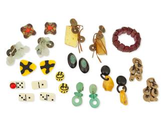 3002
A Large Group Of Costume Jewelry
Mid/late 20th century
Fourteen works:

Gerda Lynggaard (b. 20th century)
Each stamped to tag: Gerda Lynggaard pour Monies Copenhagen
A pair of Danish chunky resin and amber drop earrings, 2 pieces
Each: 3.5" H

A group of multicolored costume jewelry
Each appears unmarked
Thirteen works including an expandable bracelet with tumbled purple resin "stones" (6.5" inner C x 1.5" H), four domino game piece brooches, one with an added red jewel (Each: 0.875" H x 1.625" W), and eight pairs of earrings in various shapes and styles including three pairs with stone, coin or antler dangles, two pairs in carved green resin and horn, two pairs of yellow and black earrings and a pair with multicolored beads (Largest:4" H; Smallest: 1.125" Dia.), 21 pieces

23 pieces total
Estimate: $300 - $500